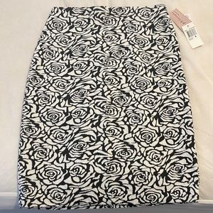The cutest pencil skirt, never worn! Black and white in a floral pattern!